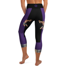 Back view of Ziva purple and black Lupus Warrior women's capri leggings with Star of David waistband and miniature HeroicU artwork