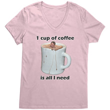A light pink v-neck coffee shirt with an image of a person swimming in a large white cup of coffee, with the text '1 CUP OF COFFEE IS ALL I NEED' below the image.